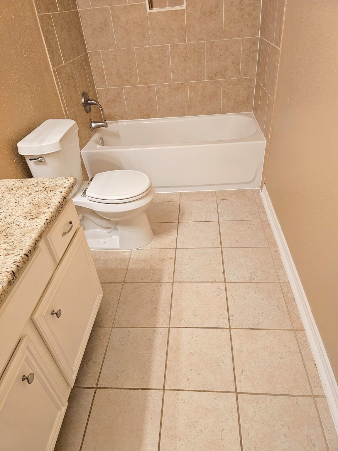 2327 Shadbury Court Houston, TX 77339 - Photo 25 of 32 a bathroom with a toilet and a shower