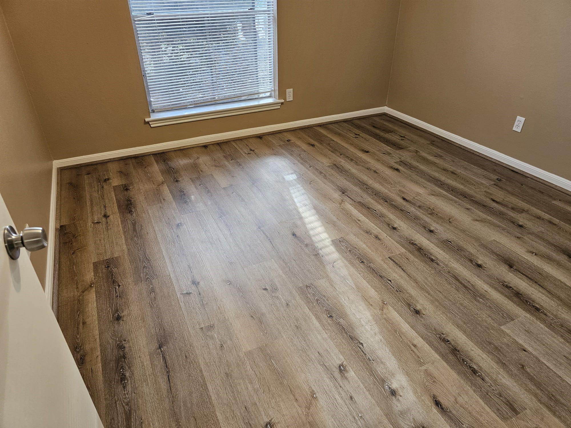2327 Shadbury Court Houston, TX 77339 - Photo 31 of 32 a view of a room with wooden floor and a window