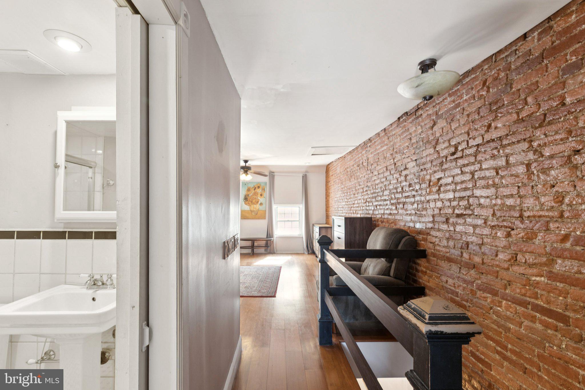 618 South 21st Street Philadelphia, PA 19146 - Photo 14 of 16 a bathroom with a sink a toilet a mirror and shower