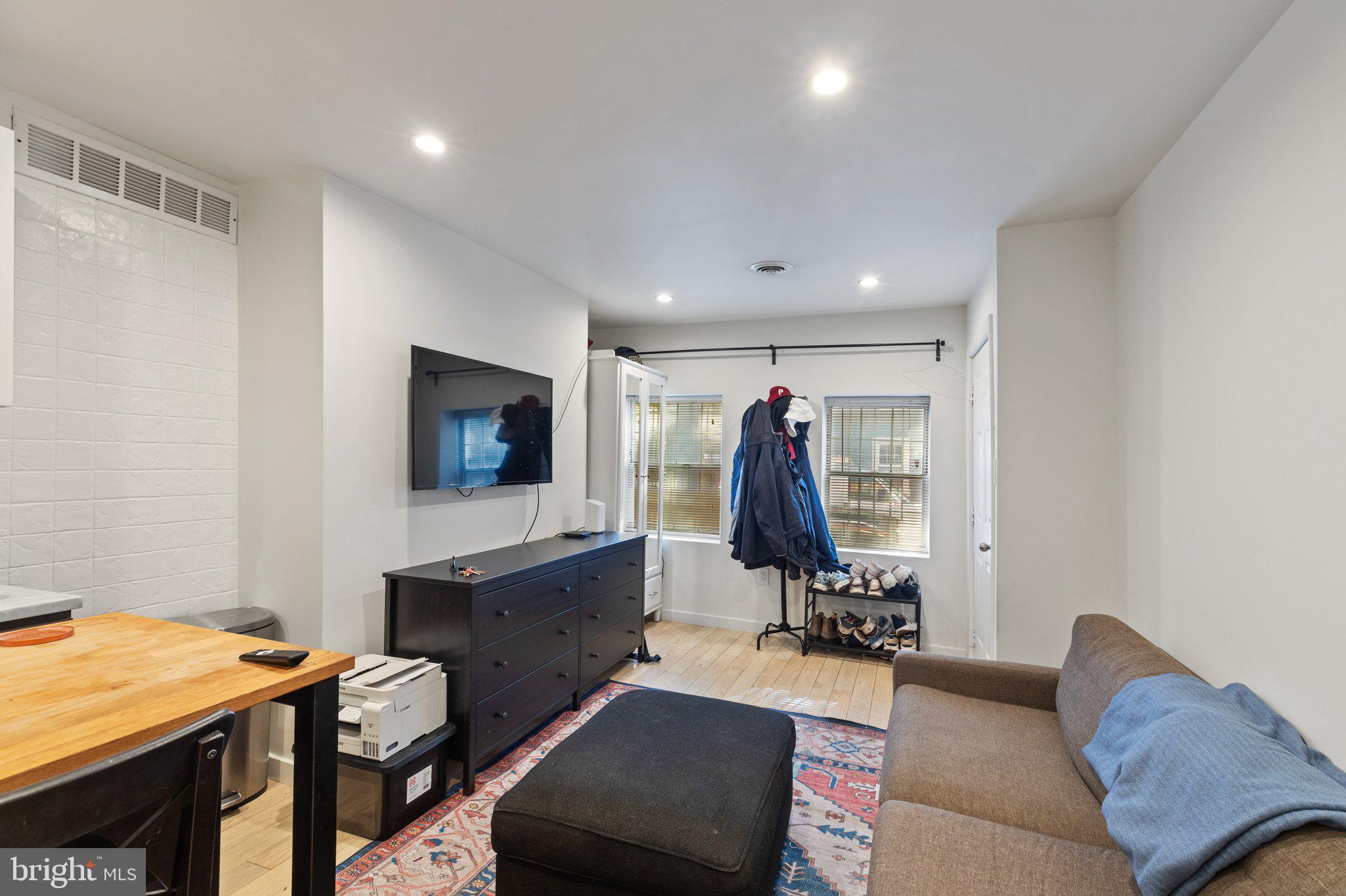 618 South 21st Street Philadelphia, PA 19146 - Photo 3 of 16 a view of a livingroom with furniture and a flat screen tv