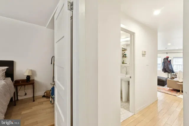 a view of a hallway view with living room and dining room view