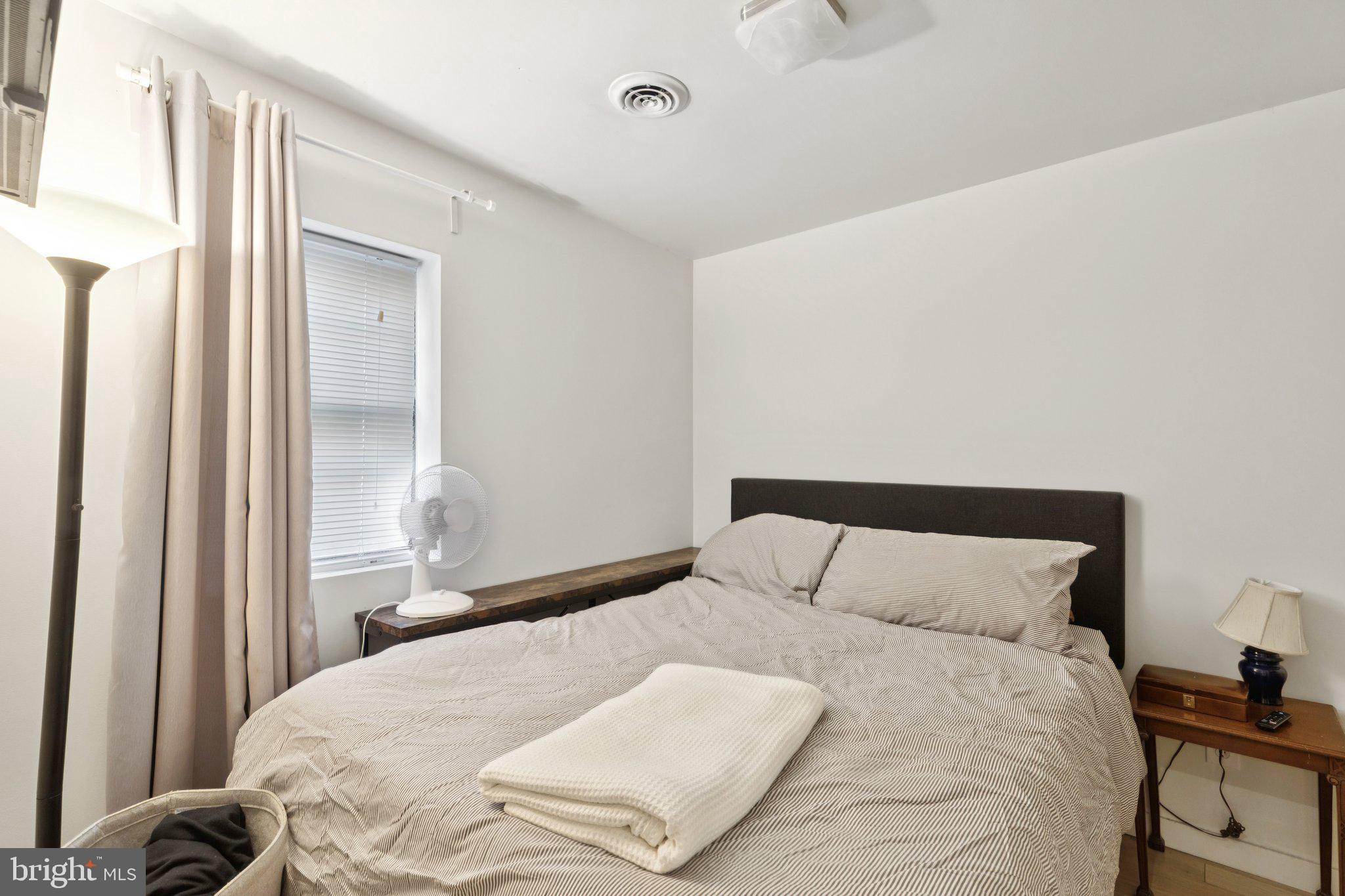 618 South 21st Street Philadelphia, PA 19146 - Photo 5 of 16 a bedroom with a bed and a window