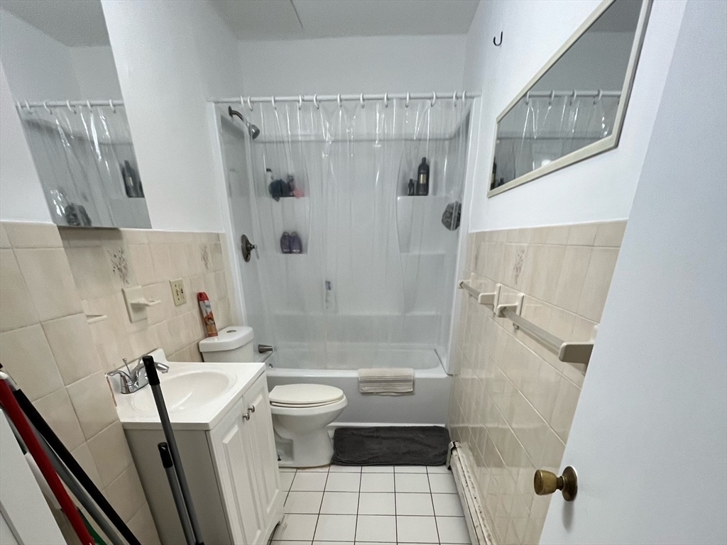 22 Marcella Street, Unit 2 Cambridge, MA 02141 - Photo 8 of 9 a bathroom with a sink toilet and shower