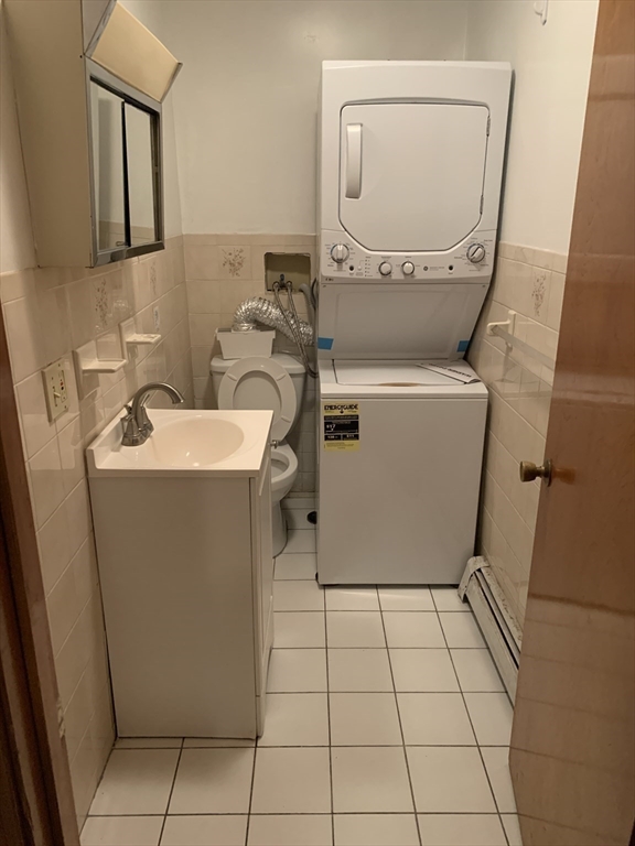 22 Marcella Street, Unit 2 Cambridge, MA 02141 - Photo 9 of 9 a utility room with dryer and washer
