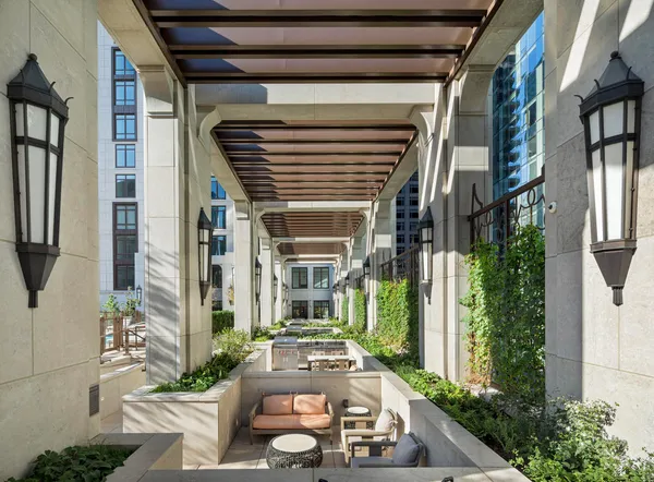 a front view of a house with outdoor seating