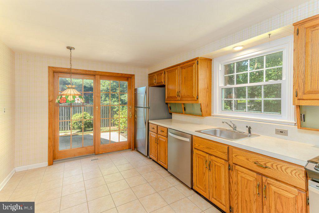 324 Wayland Road Cherry Hill, NJ 08034 - Photo 11 of 28 a kitchen with stainless steel appliances granite countertop a sink and a granite counter tops with a large window