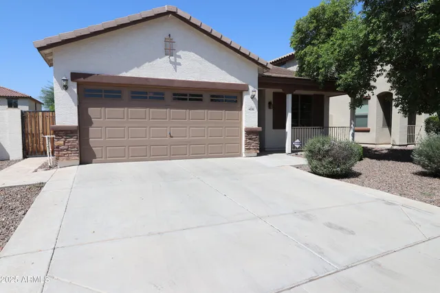 a front view of a house with garage