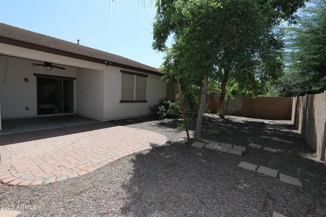 a backyard of a house with lots of green space