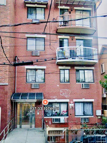 a red brick building with glass windows