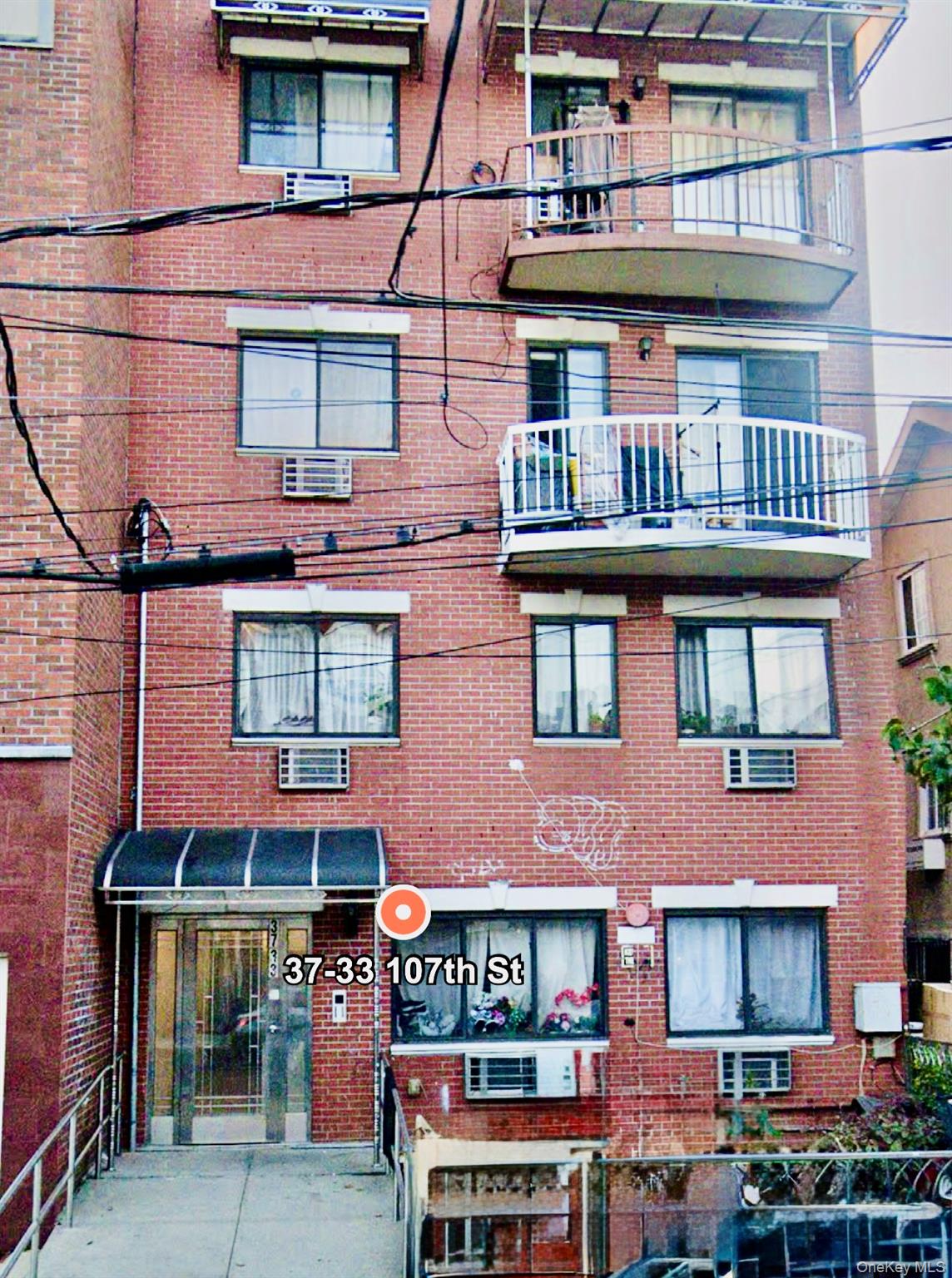 a red brick building with glass windows