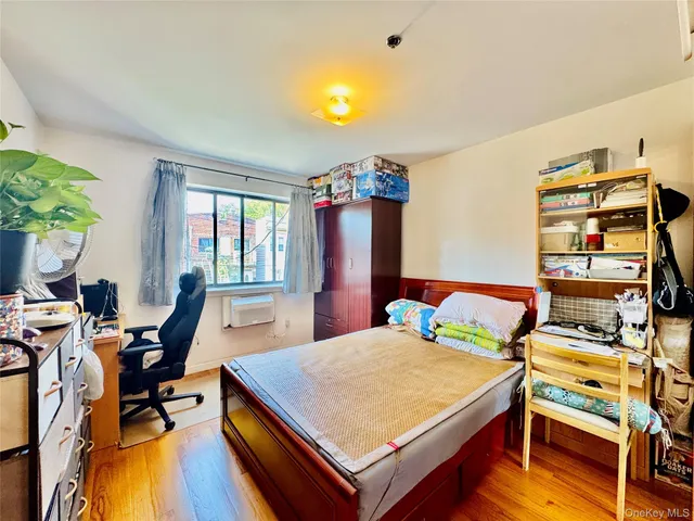 a bed room with a bed and a chair