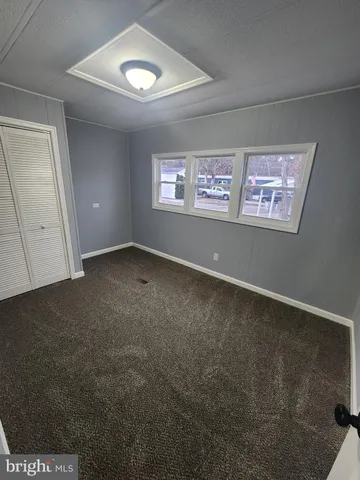 an empty room with a space and a window