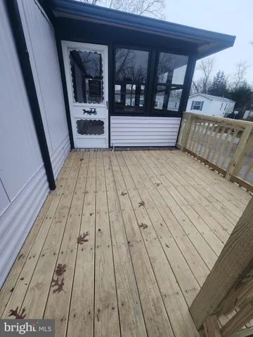 a view of balcony with wooden floor