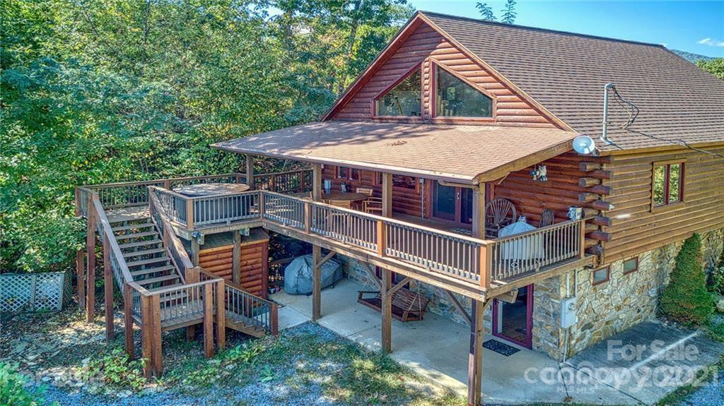 a roof deck with table and chairs