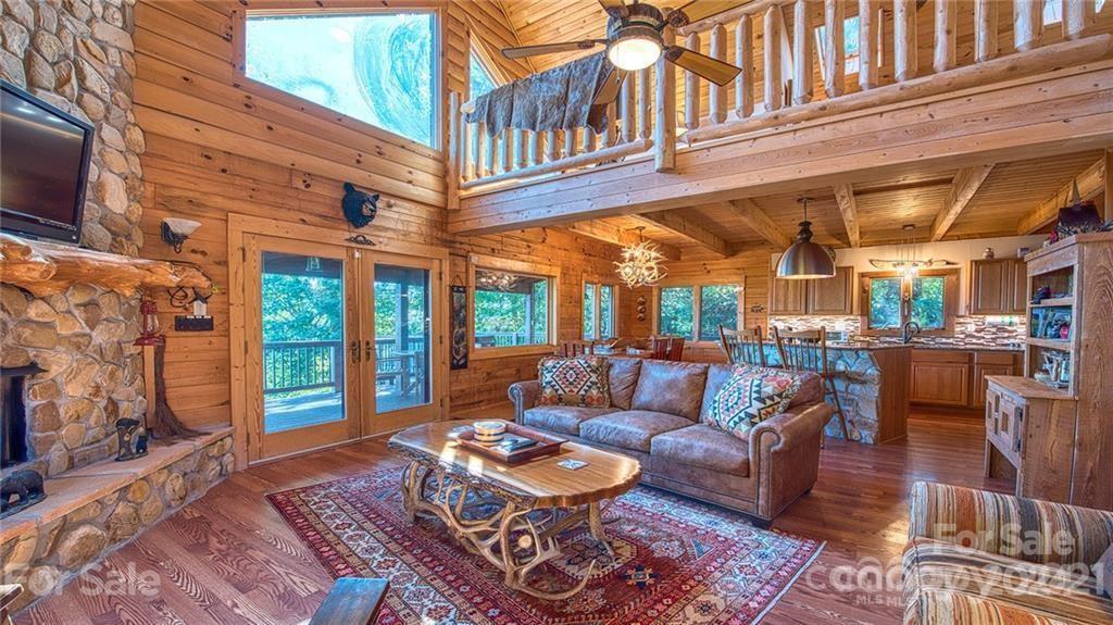 135 Aerial Ridge Waynesville, NC 28785 - Photo 13 of 27 a view of a chairs and a table in the patio