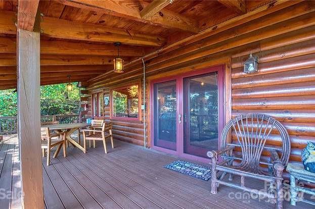 135 Aerial Ridge Waynesville, NC 28785 - Photo 20 of 27 a view of a chairs and table in a patio