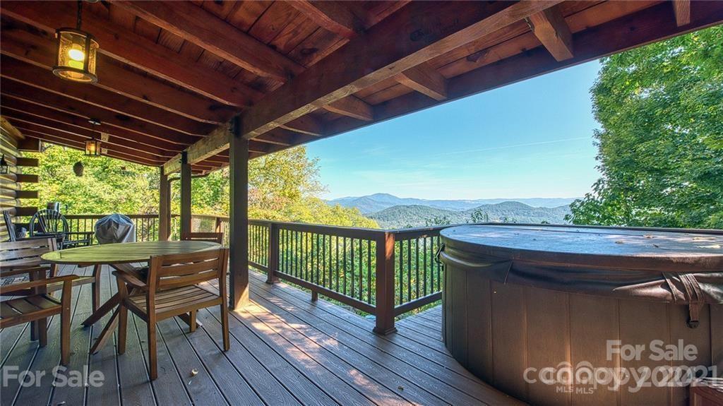 135 Aerial Ridge Waynesville, NC 28785 - Photo 24 of 27 a view of a chairs and table in the balcony