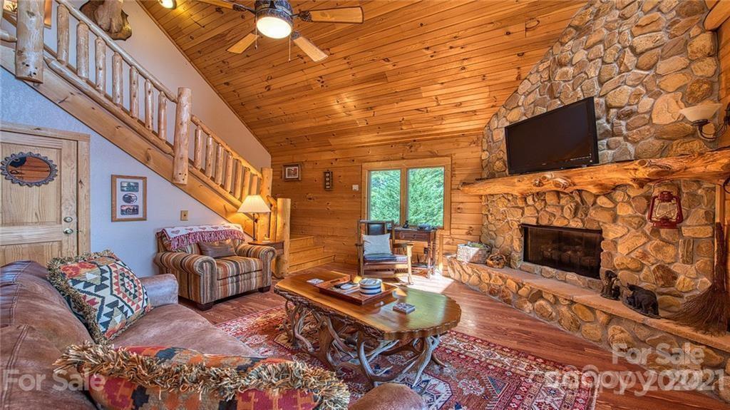 135 Aerial Ridge Waynesville, NC 28785 - Photo 8 of 27 a living room with furniture and a flat screen tv