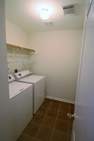 a backyard of a house with seating space