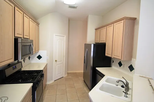 a bathroom with a sink a toilet and a bathtub