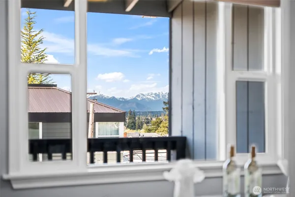 a view of a balcony dining table and chairs