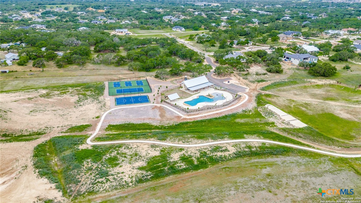 980 Scarlett Ridge Drive Bulverde, TX 78163 - Photo 2 of 13 a view of a backyard with swimming pool