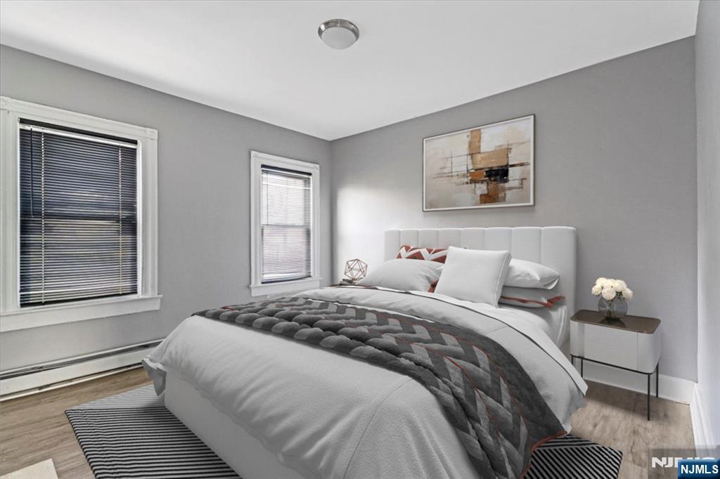 580 Hunterdon Street Newark, NJ 07108 - Photo 12 of 29 a bedroom with a bed and a window