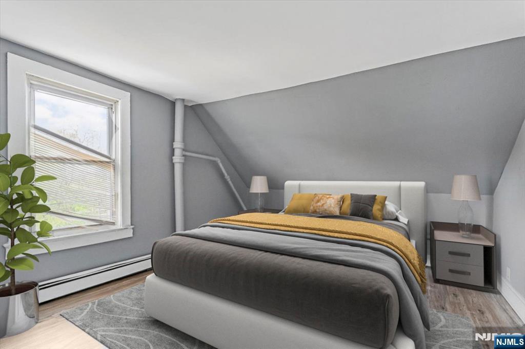 580 Hunterdon Street Newark, NJ 07108 - Photo 13 of 29 a bedroom with a bed and a window