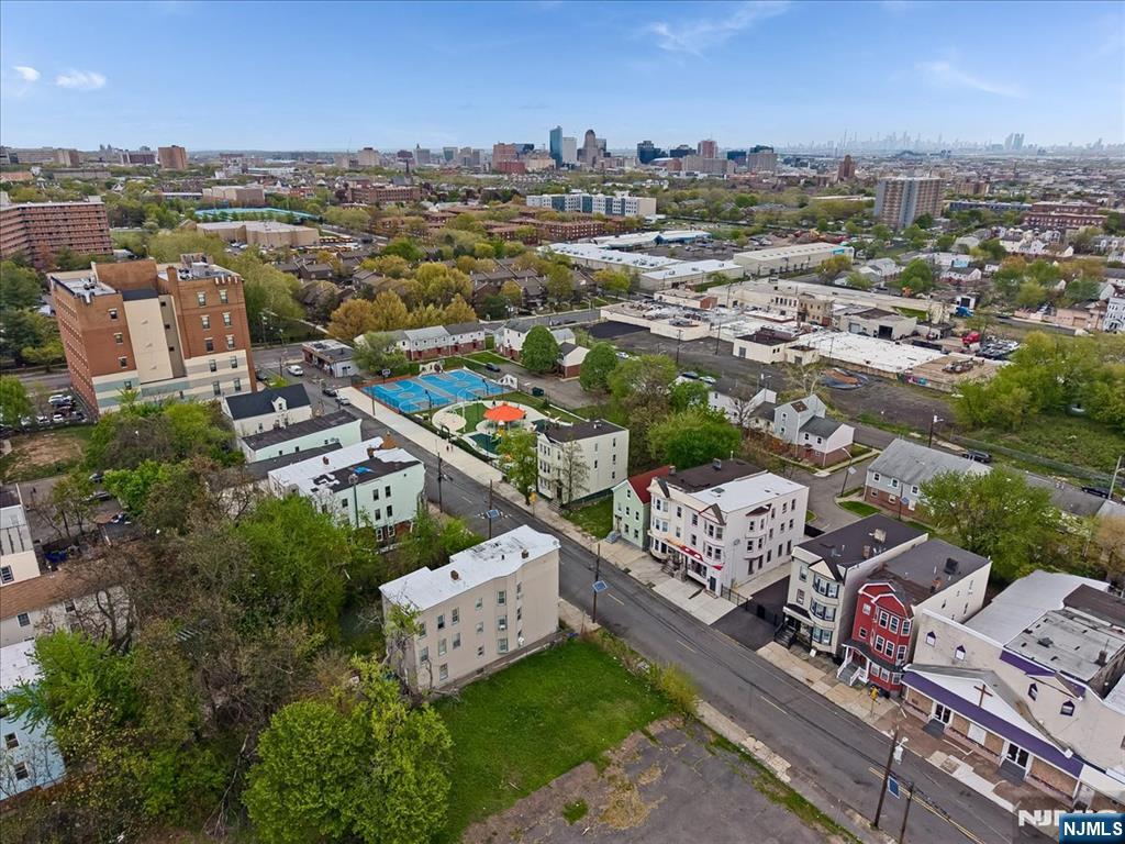 580 Hunterdon Street Newark, NJ 07108 - Photo 28 of 29 an aerial view of a city with lots of residential buildings ocean and mountain view in back