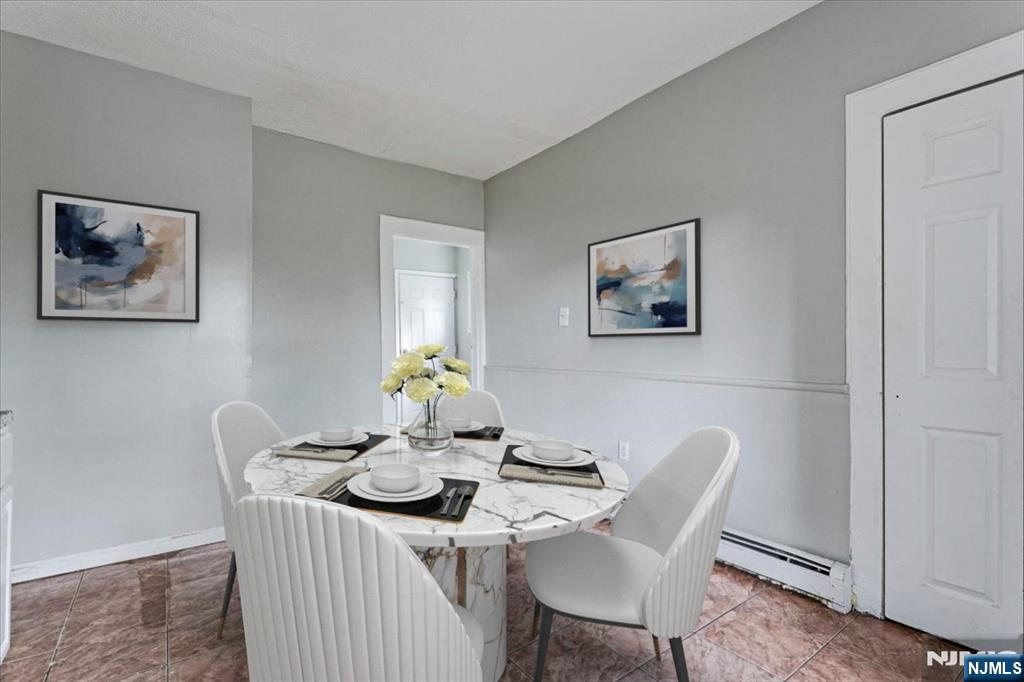 580 Hunterdon Street Newark, NJ 07108 - Photo 4 of 29 a dining room with furniture and window