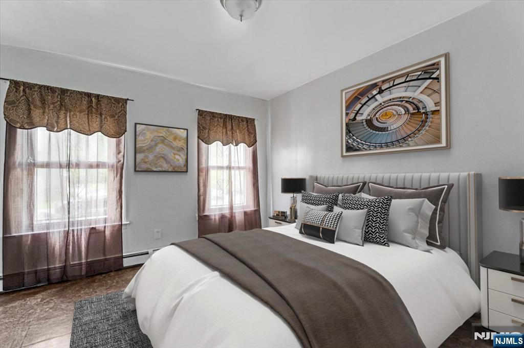 580 Hunterdon Street Newark, NJ 07108 - Photo 5 of 29 a bedroom with bed and a window