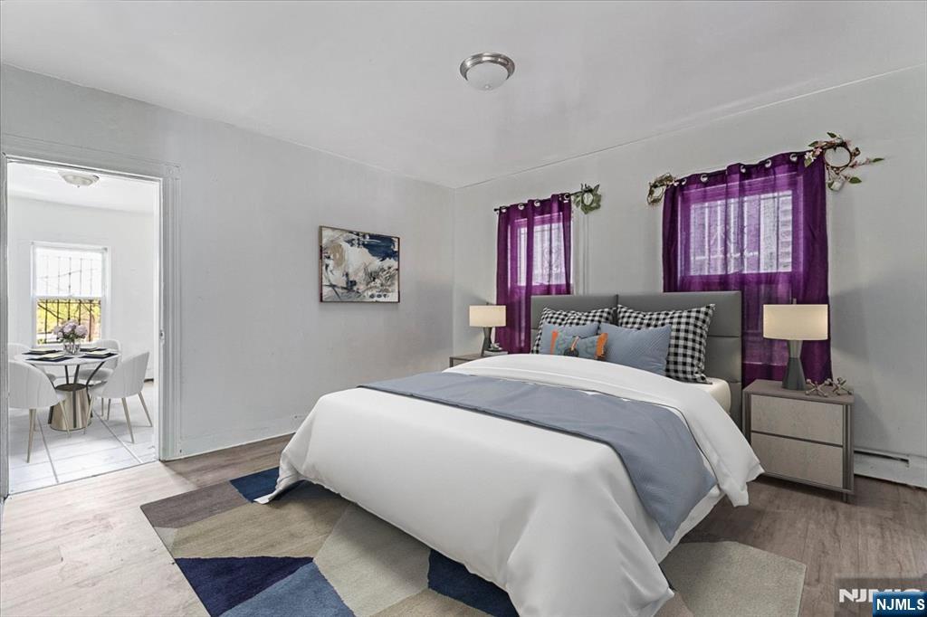580 Hunterdon Street Newark, NJ 07108 - Photo 6 of 29 a bedroom with bed and window