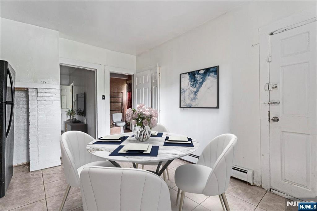 580 Hunterdon Street Newark, NJ 07108 - Photo 10 of 29 a dining room with furniture and window