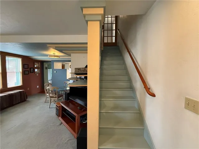 a bathroom with a sink mirror and toilet