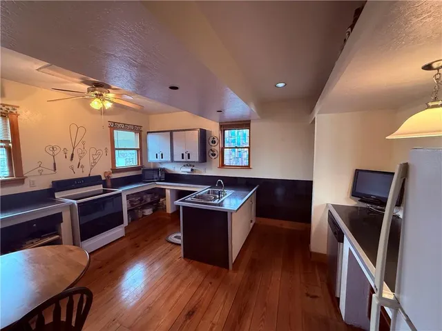 a kitchen with stainless steel appliances granite countertop a stove and a sink