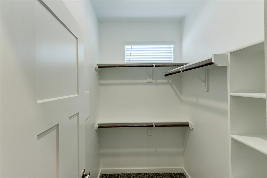 760 Double Mountain Road College Station, TX 77845 - Photo 14 of 26 a view of walk in closet with empty racks