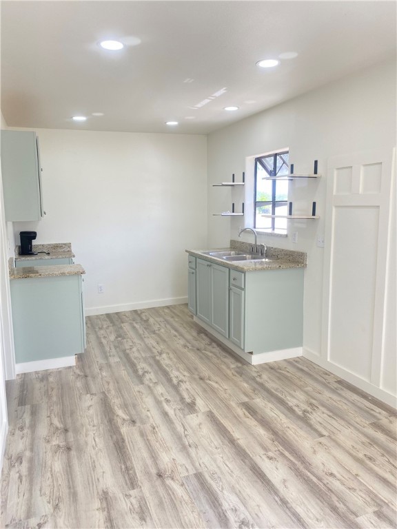 101 North Julian Street, Unit 1 San Diego, TX 78384 - Photo 3 of 12 a view of kitchen with cabinets and wooden floor