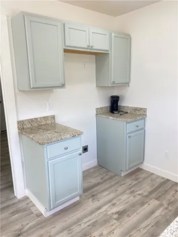 a kitchen with a stove and cabinets