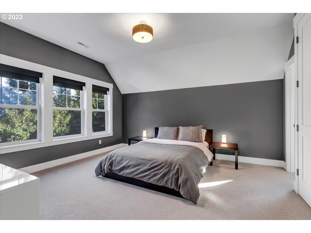 3620 Southwest 64th Place Portland, OR 97221 - Photo 19 of 32 a bedroom with a bed and window