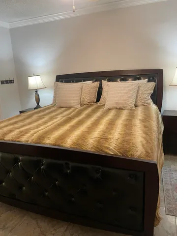 a white toilet sitting next to a bath tub and shower