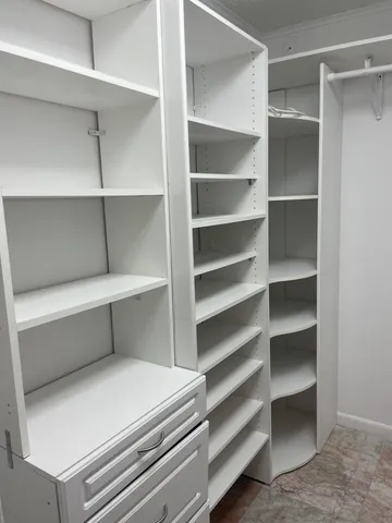 an aerial view of residential houses with outdoor space and lake view