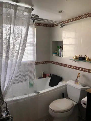 a sign of golf club on a tree