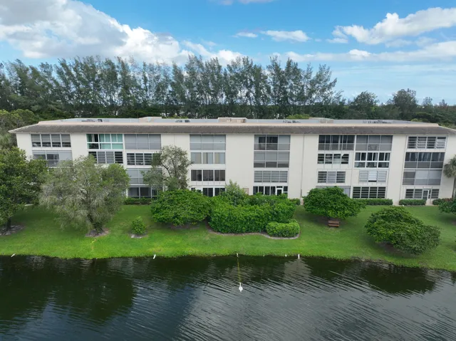 a living room with furniture and a book shelf
