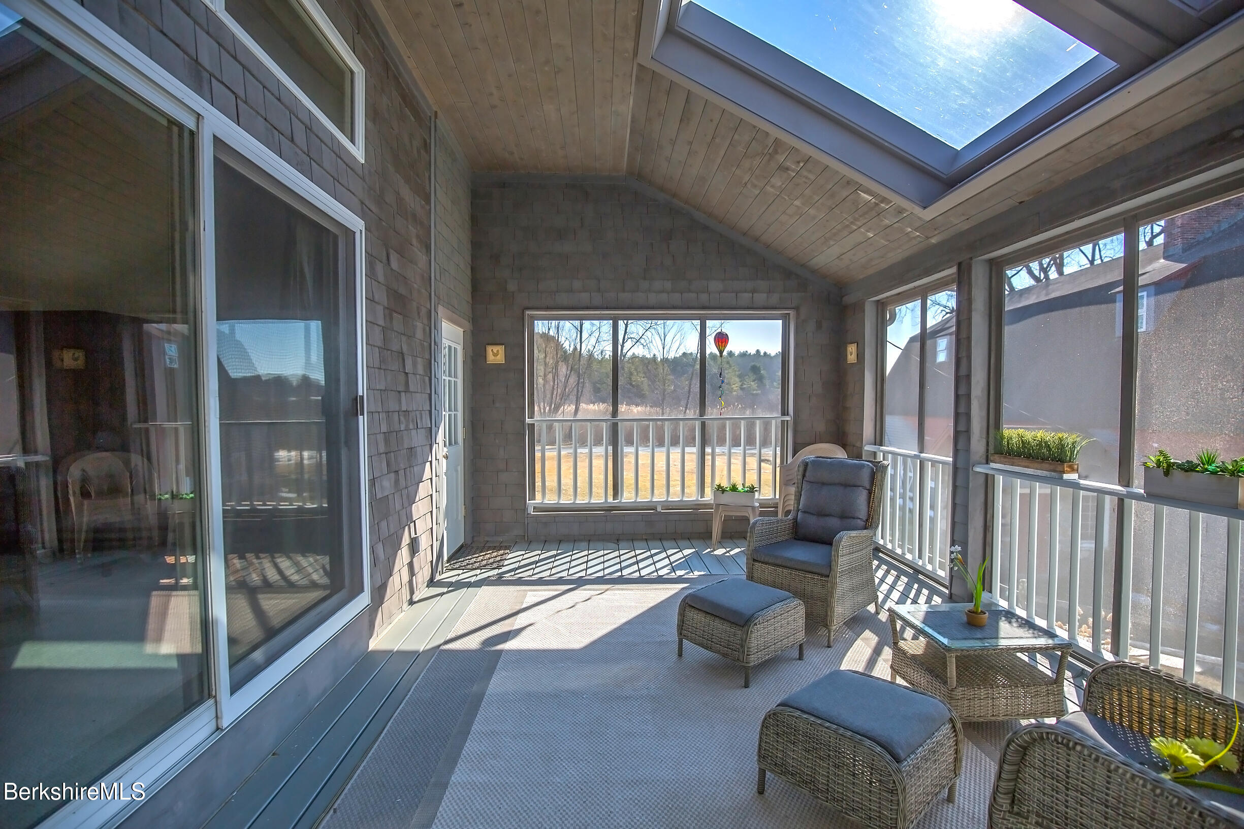 2 Wallace Road, Unit 2E Stockbridge, MA 01262 - Photo 14 of 50 a living room with furniture and a floor to ceiling window