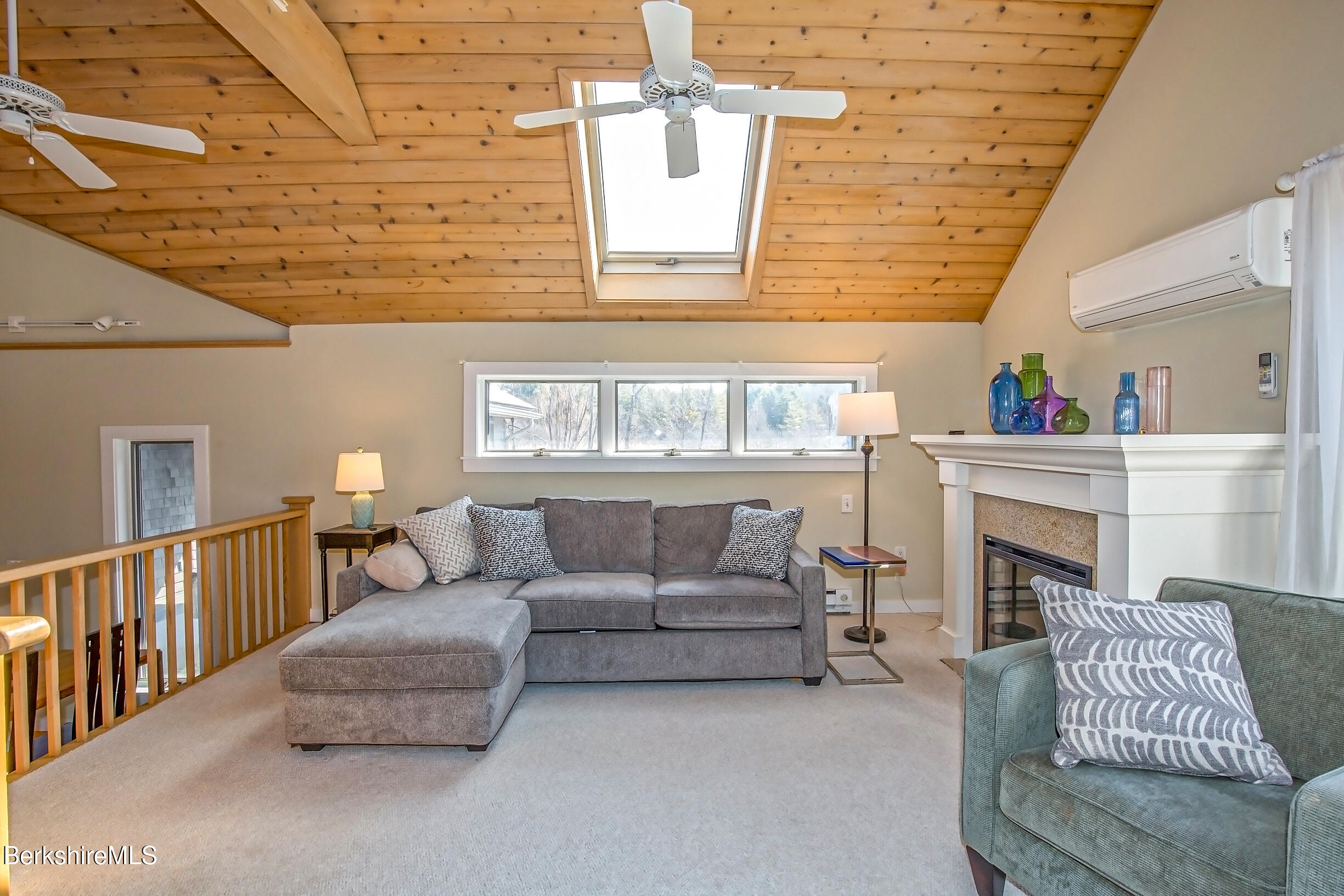 2 Wallace Road, Unit 2E Stockbridge, MA 01262 - Photo 16 of 50 a living room with furniture and a fireplace