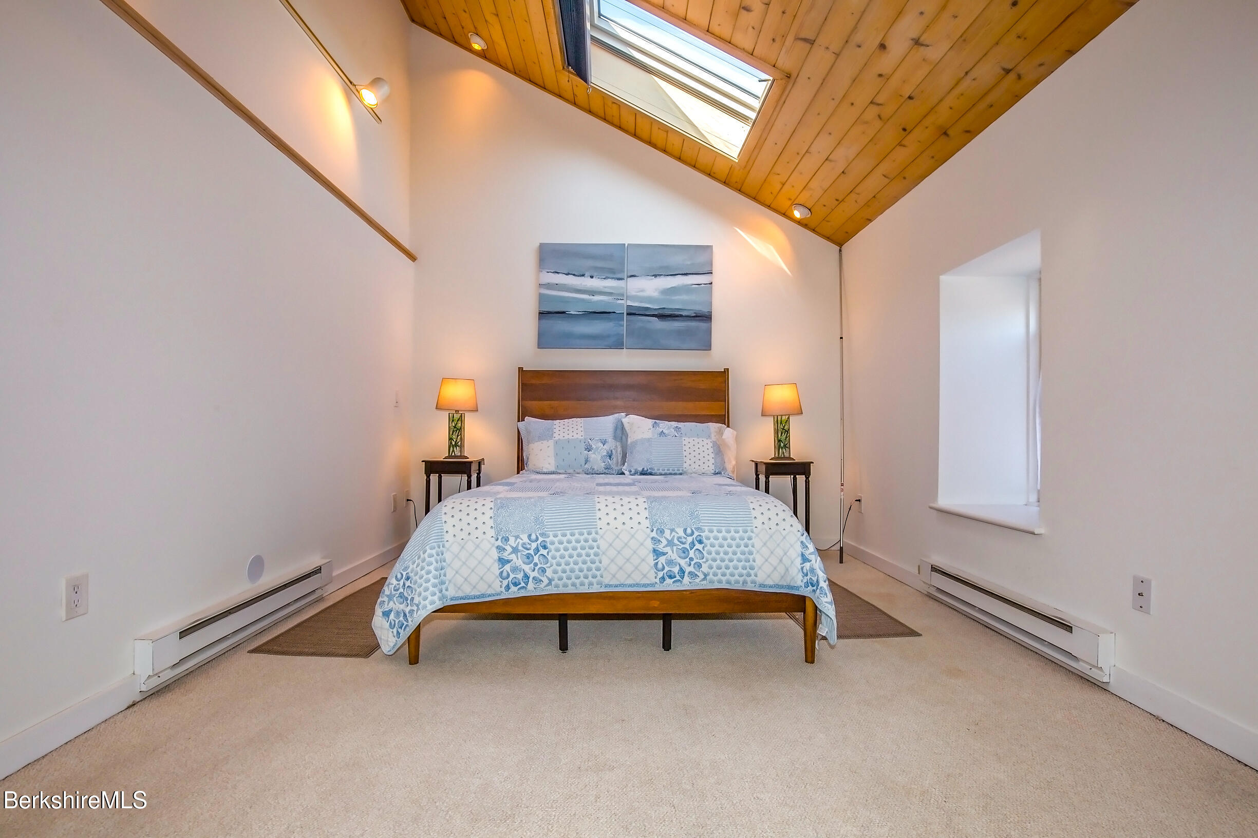 2 Wallace Road, Unit 2E Stockbridge, MA 01262 - Photo 25 of 50 a bedroom with a bed and window