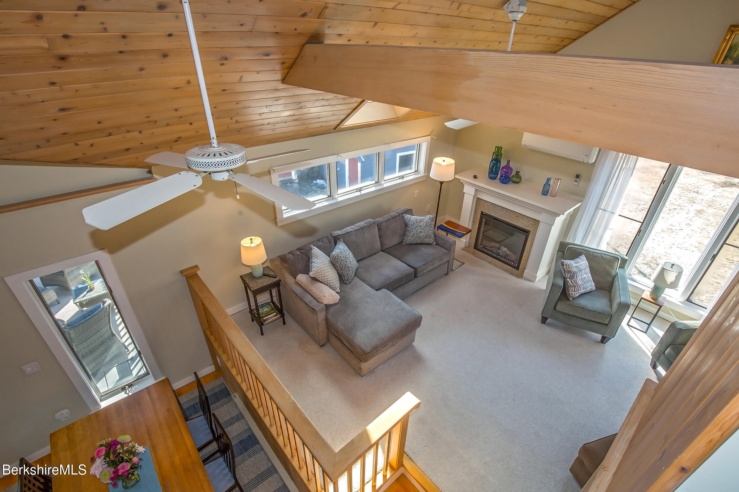 2 Wallace Road, Unit 2E Stockbridge, MA 01262 - Photo 34 of 50 a living room with furniture and a fireplace