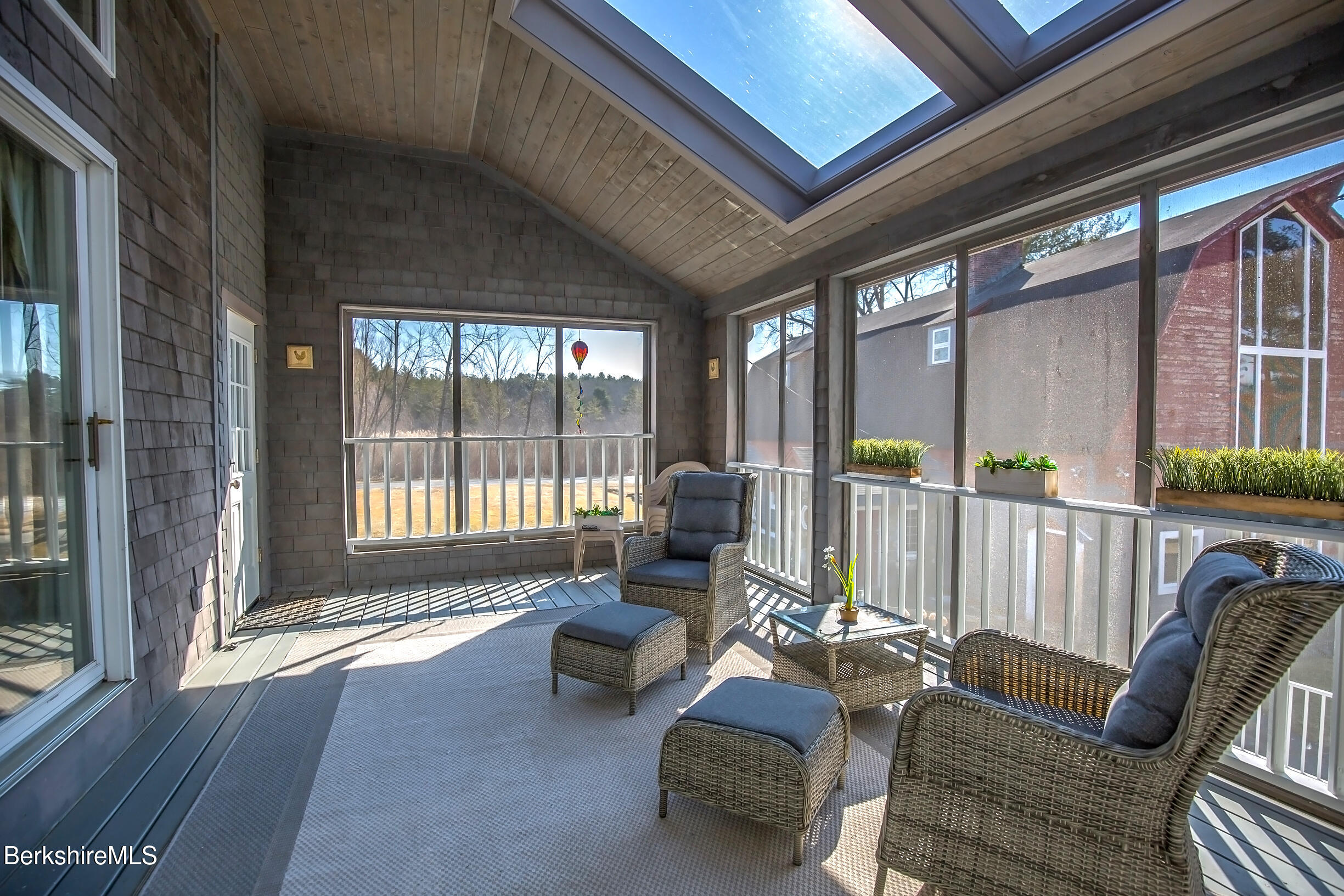 2 Wallace Road, Unit 2E Stockbridge, MA 01262 - Photo 36 of 50 a living room with furniture and a floor to ceiling window