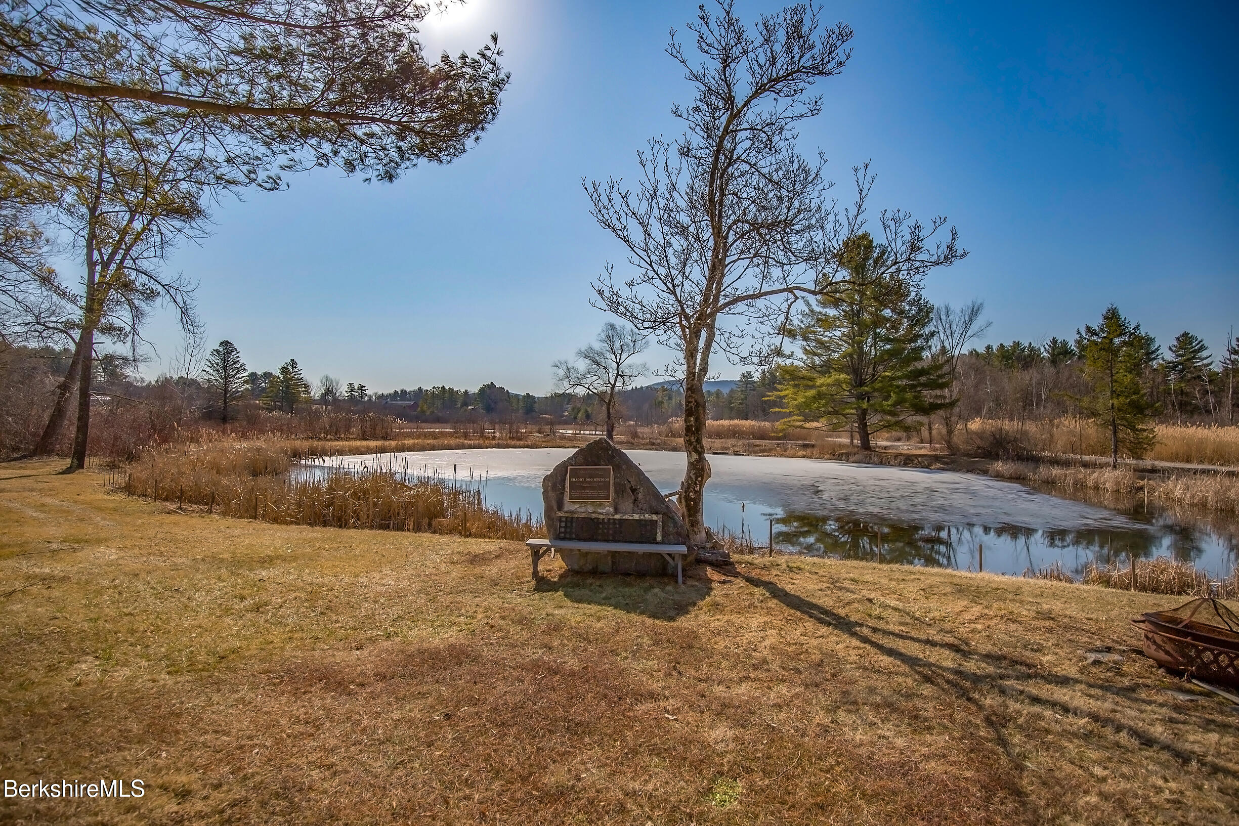 2 Wallace Road, Unit 2E Stockbridge, MA 01262 - Photo 38 of 50 a backyard of a house with trees and outdoor space