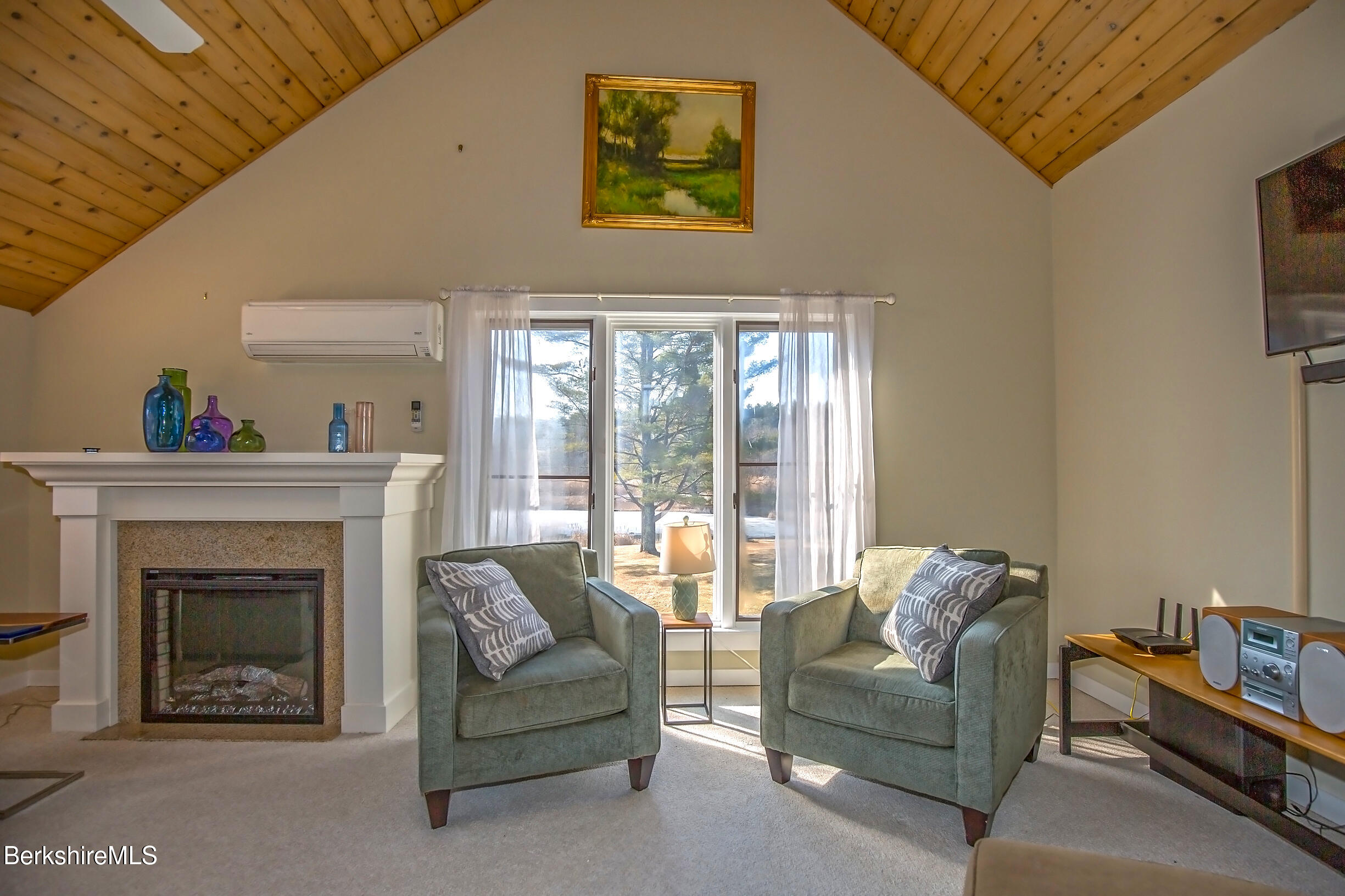 2 Wallace Road, Unit 2E Stockbridge, MA 01262 - Photo 5 of 50 a living room with furniture a window and a fireplace
